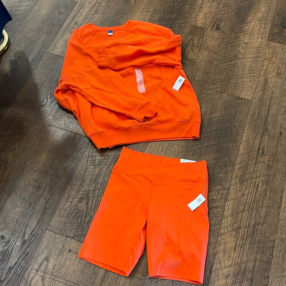 Two piece set. Poppy red bike short and oversized sweatshirt set. NWT